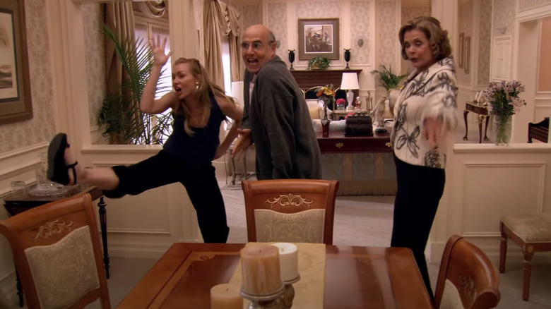 Lucille, George, and Lindsay Bluth doing over-the-top impersonations of a chicken