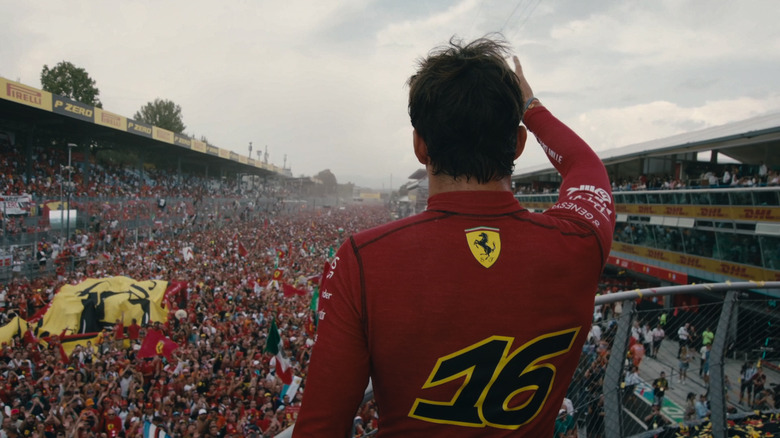 Charles Leclerc waving to a roaring crowd of F1 fans in Formula 1: Drive to Survive (2025)
