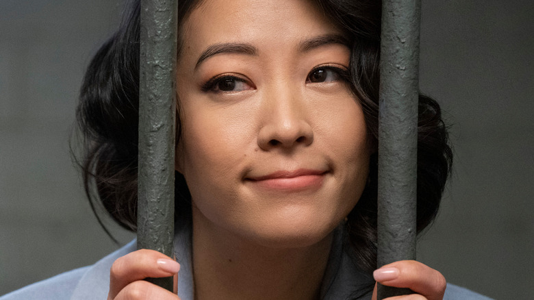 Ingrid Yun from Partner Track smiling behind jail bars