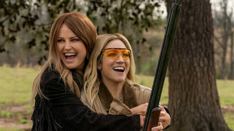 Margo and Sophie giggle with a gun on 