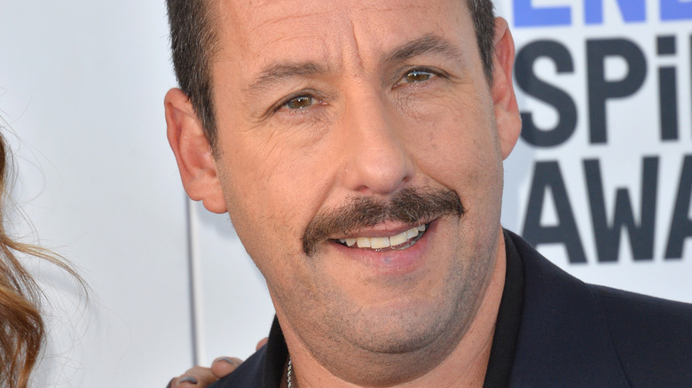 Adam Sandler smiles