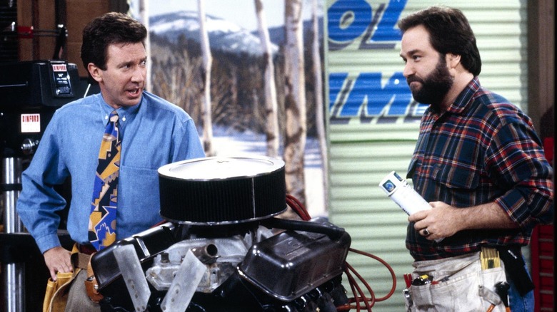 Tim Taylor and Al Borland look at Tim's latest creation in "Home Improvement"