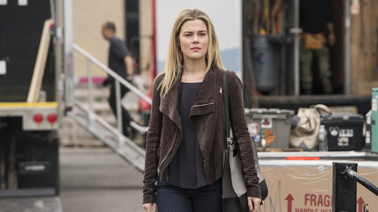 Trish Walker strolling around a set in Jessica Jones (2018)