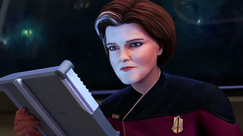 Janeway looks at a PADD