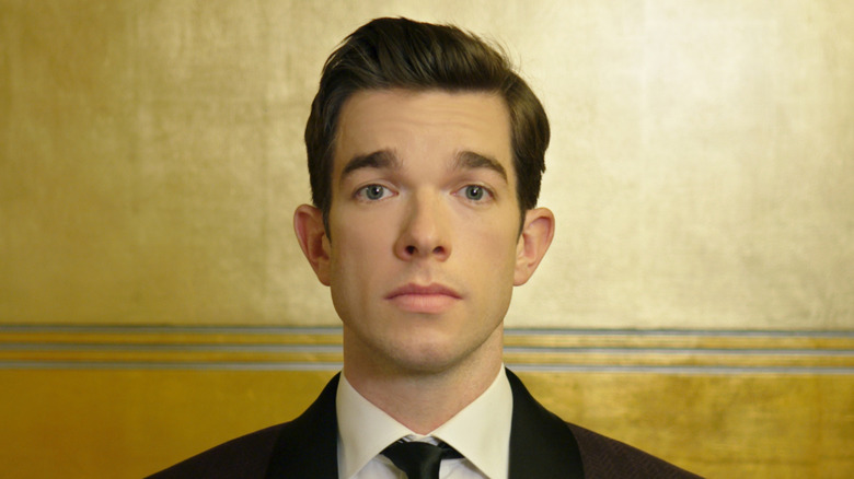 John Mulaney staring at the camera in 