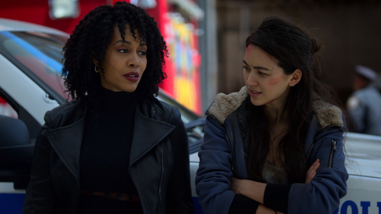 Misty Knight and Colleen Wing leaning on car