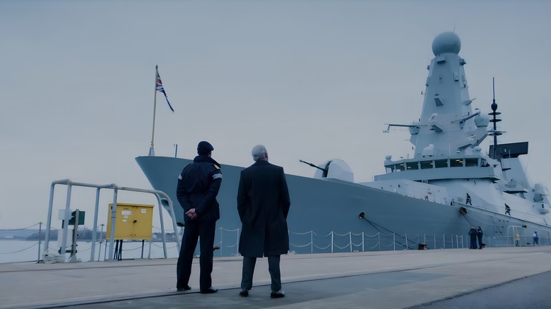 Men looking at ship