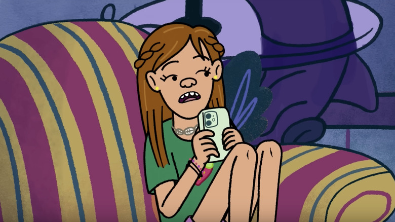 Hannah sits using a phone on "Long Story Short" (2025)