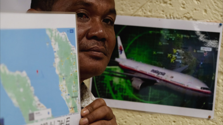 Sad Man Holding Map