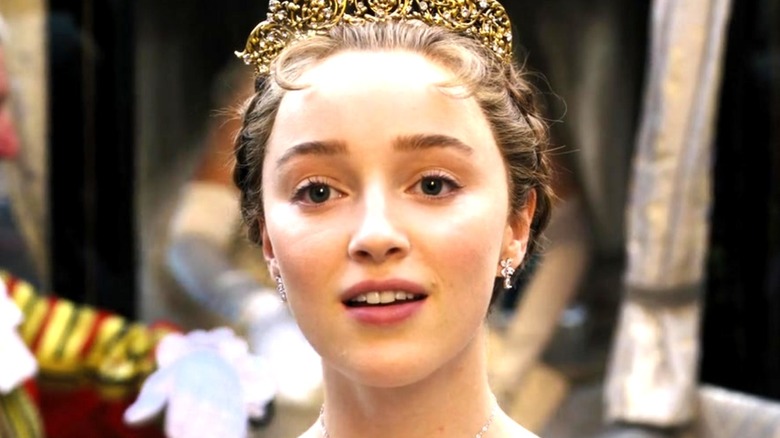 Phoebe Dynevor as Daphne looking pleased