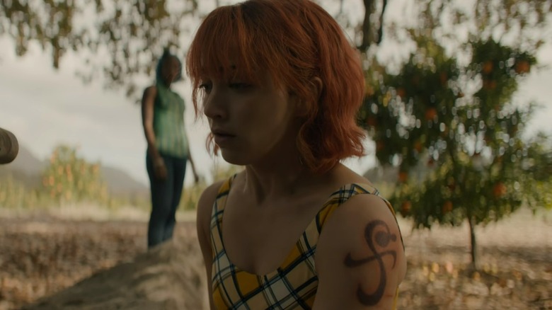 Nami kneeling shoulder tattoo