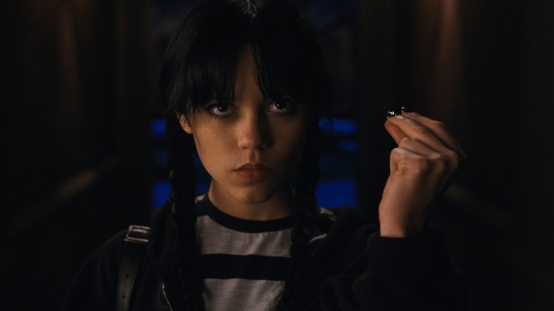 Wednesday Addams snapping her fingers