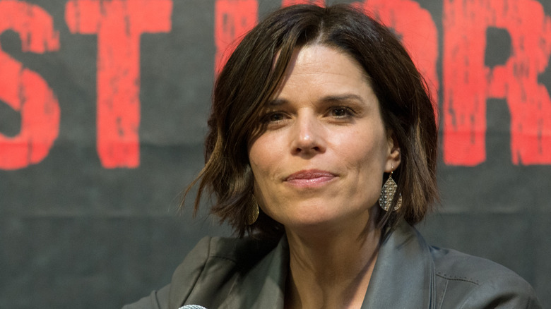 Neve Campbell sits on panel