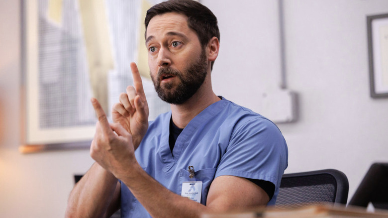 Dr. Max Goodwin talking while gesturing with his hands