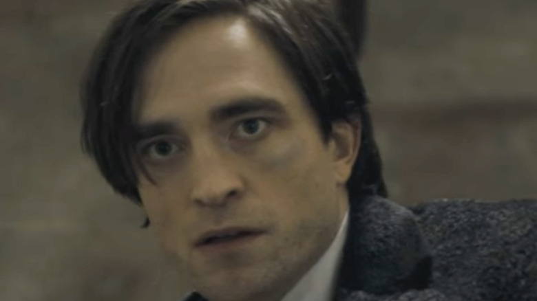 Robert Pattinson as Bruce Wayne looking concerned