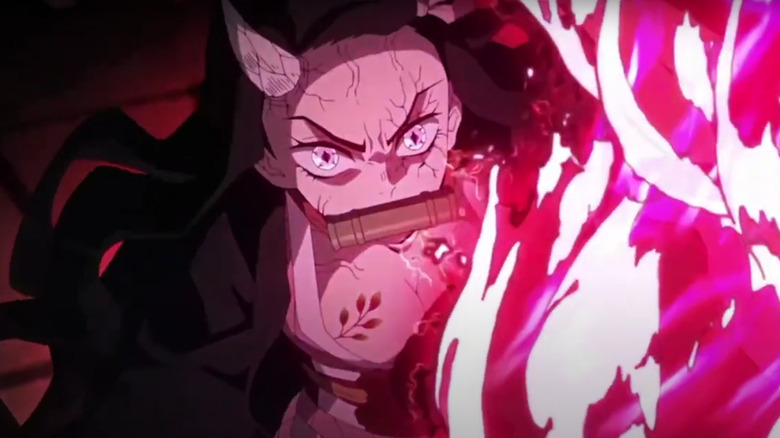 Nezuko blocks an energy blast