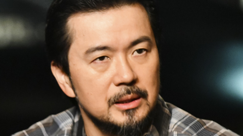 Justin Lin brown plaid shirt