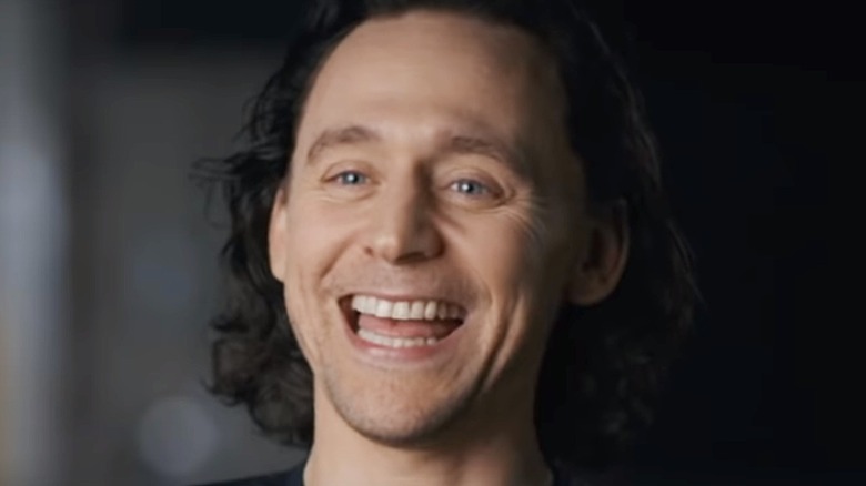 Tom Hiddleston laughing