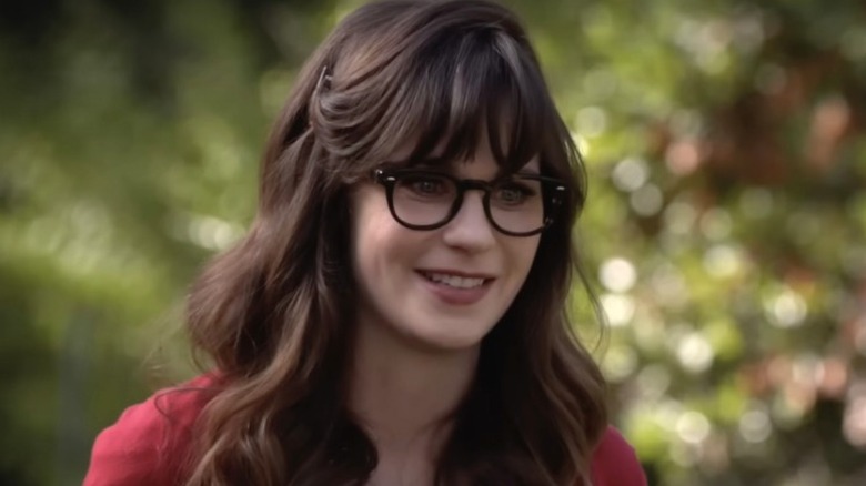 Jess wearing glasses smiling