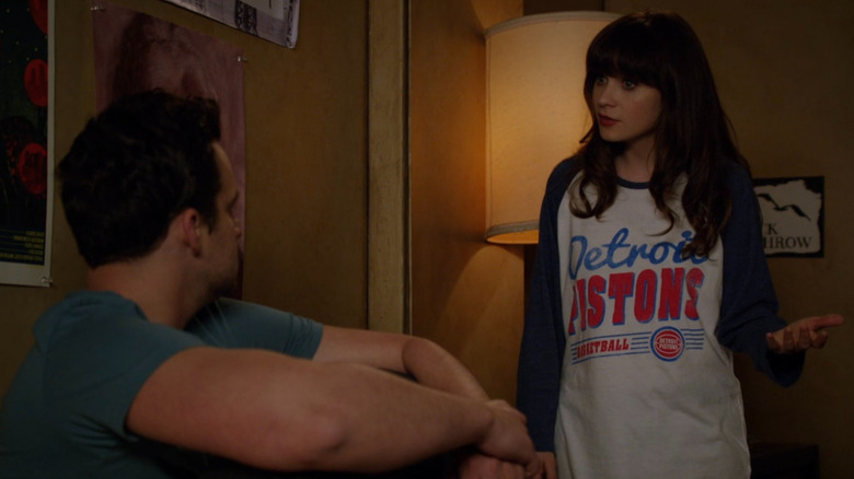 Nick sitting in bed talking to Jess