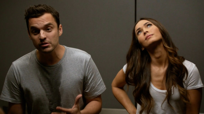 Nick and Reagan standing in an elevator