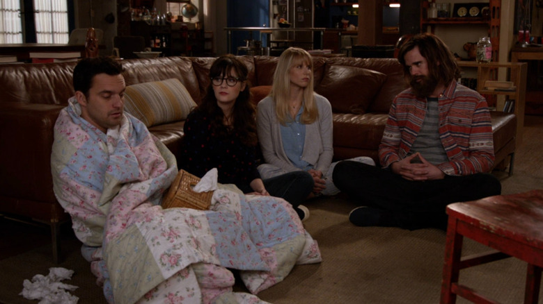 Nick, Jess, Genevieve, and Sam sitting on the loft floor