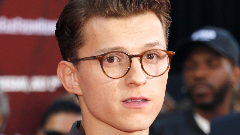Tom Holland wearing glasses