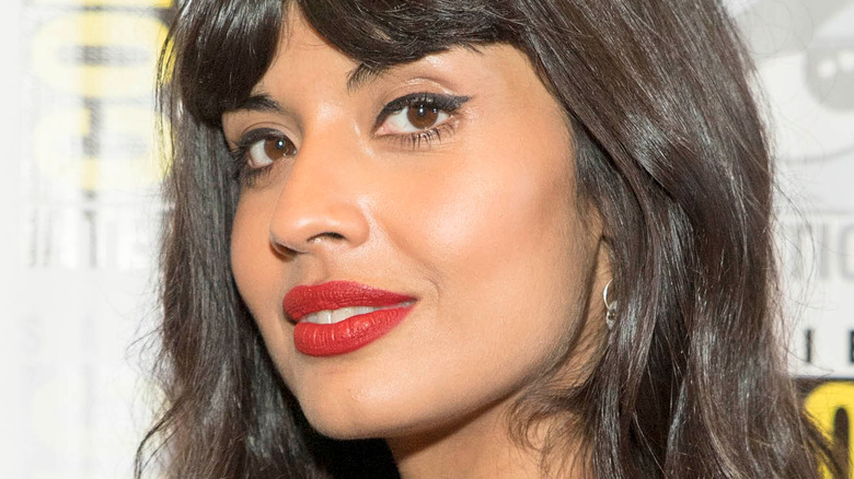 Jameela Jamil glancing over her shoulder