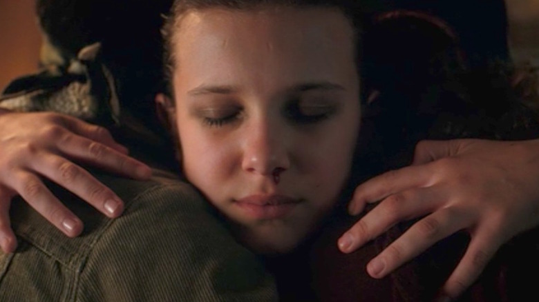 Eleven hugging friends