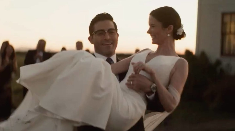 Superman holding Lois at their wedding