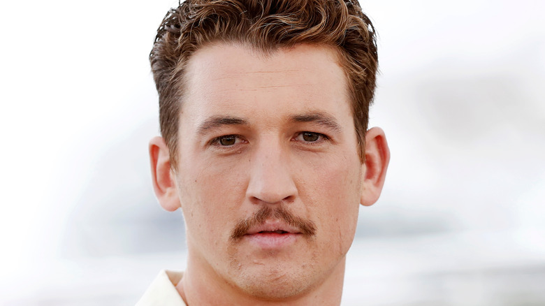 Miles Teller staring