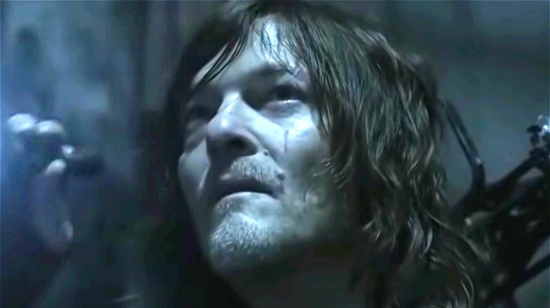 Daryl Dixon holding flashlight