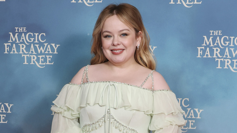 Nicola Coughlan smiling on the red carpet in 2026