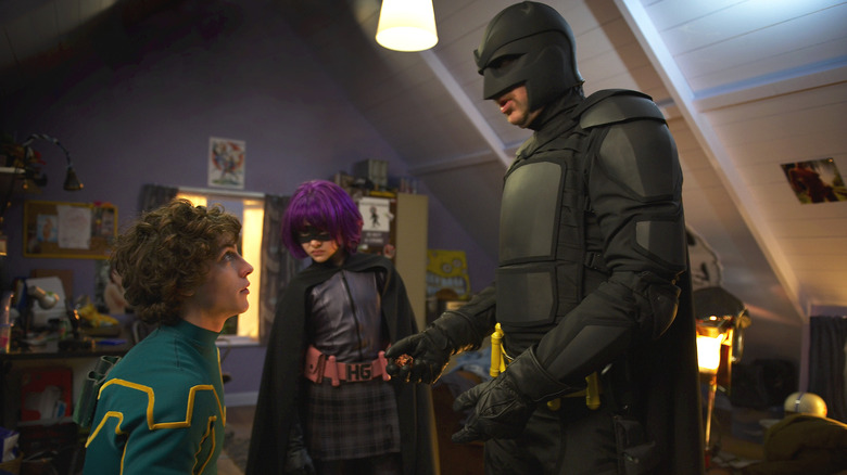 Kick-Ass listening to Hit Girl and Big Daddy in Kick-Ass (2010)