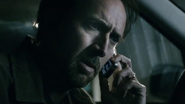 Nic Cage speaking on the phone in Seeking Justice