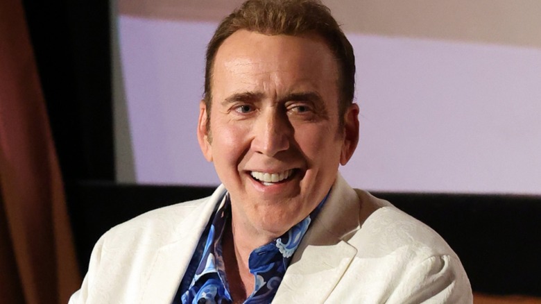 Nicolas Cage wearing a white blazer