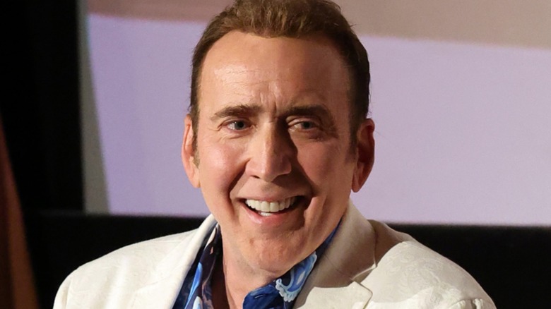 Nicolas Cage wearing a white blazer