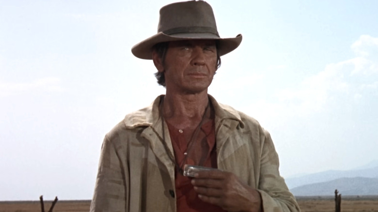 Harmonica holding a harmonica in Once Upon a Time in the West