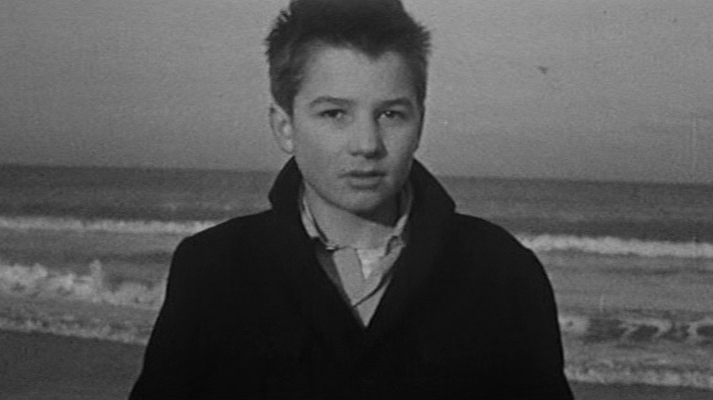 Antoine Doinel standing on the beach in The 400 Blows