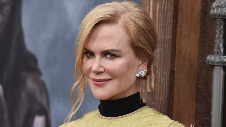 Nicole Kidman stands in a doorway