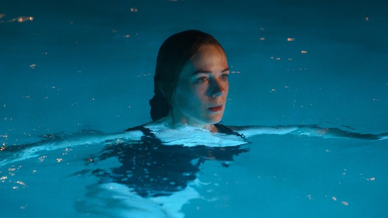 Eve floating in pool