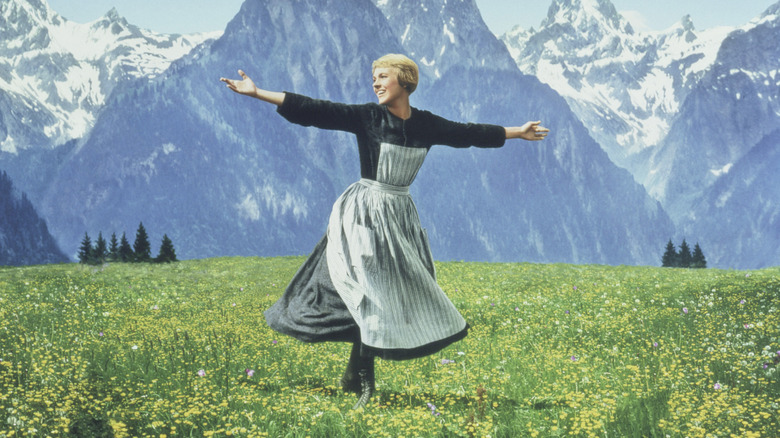 Maria spinning in a field with the Alps in the background in "The Sound of Music" (1965)