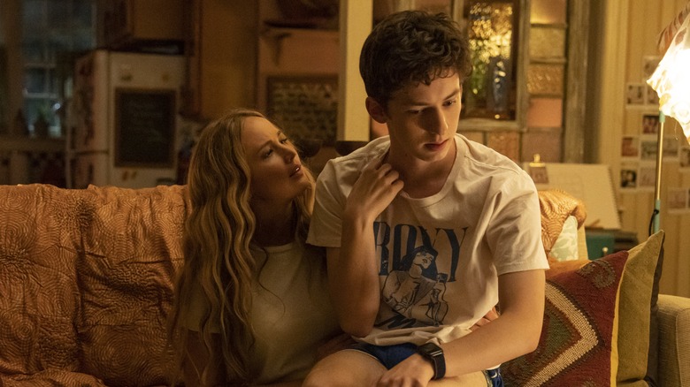 Maddie and Percy sit on a couch