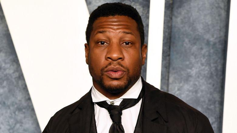 Jonathan Majors raising his eyebrows