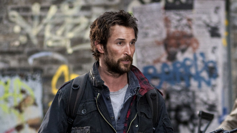 Tom Mason looking apprehensive in front of graffiti