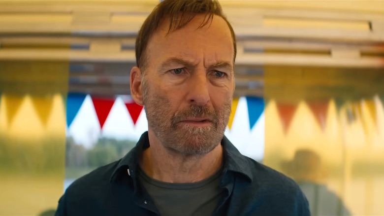 Hutch looking concerned on a boat in Nobody 2