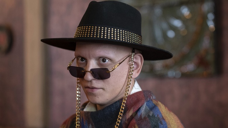 Anthony Carrigan as NoHo Hank wearing sunglasses and hat