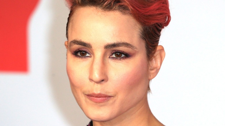 Noomi Rapace with wavy red hair