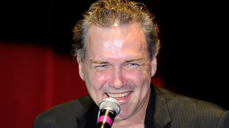 Norm Macdonald smiling while telling joke