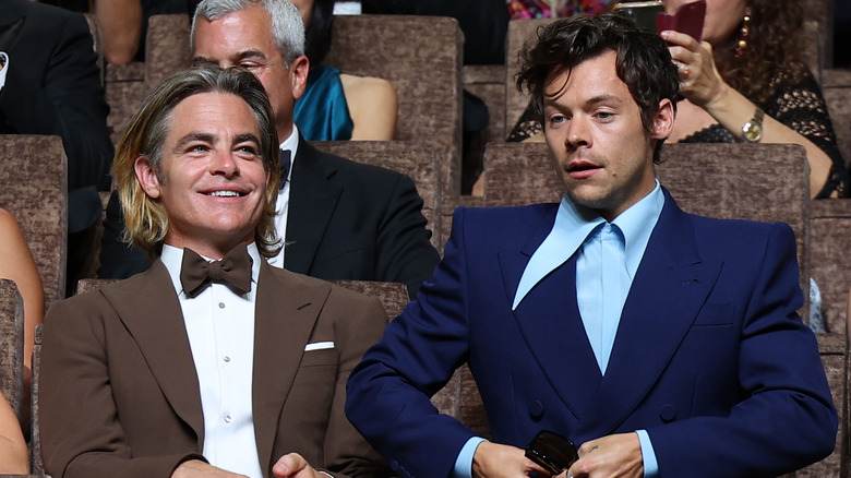 Harry Styles and Chris Pine smile